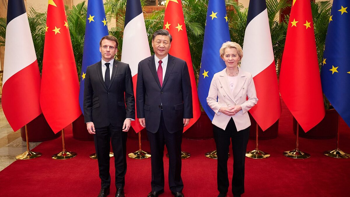 Macron and Von der Leyen stand next to Xi.